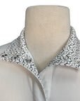 Mannequin wearing a white shirt with a bit patterned collar on a white background