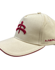 Side of MaKeBe Ball Cap in Tan/Red