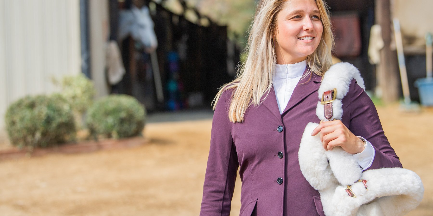 Equestrian Woman in charles ancona show jacket with halter