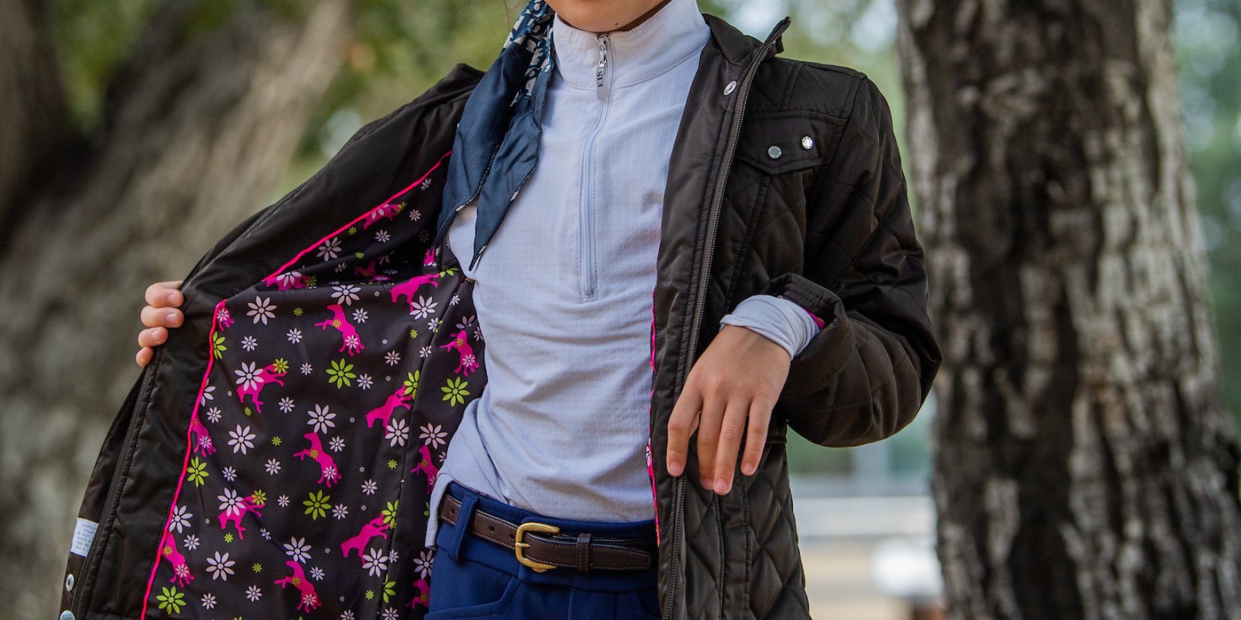 Child in horseback riding jacket and breeches