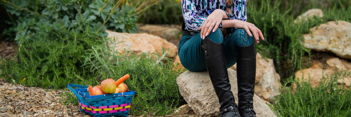 Breeches for all riders. Girl sitting on rock in Cavalleria Toscana breeches.