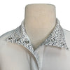 Mannequin wearing a white shirt with a bit patterned collar on a white background