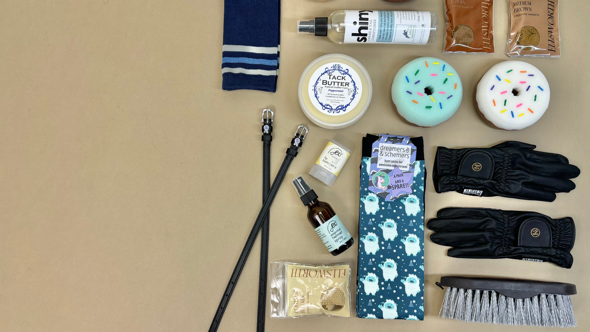 Essential items for riders stocked by Tried Equestrian. Including spur straps, socks, tack butter, Kunkle Glloves, and horse brushes.