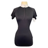 Black short-sleeve top on a mannequin with a white background