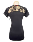 Black short-sleeve top with lace detailing on a mannequin against a white background