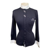 Black shirt with white collar and cuffs on a mannequin against a white background