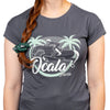 Person wearing a gray t-shirt with 'Ocala' graphic design