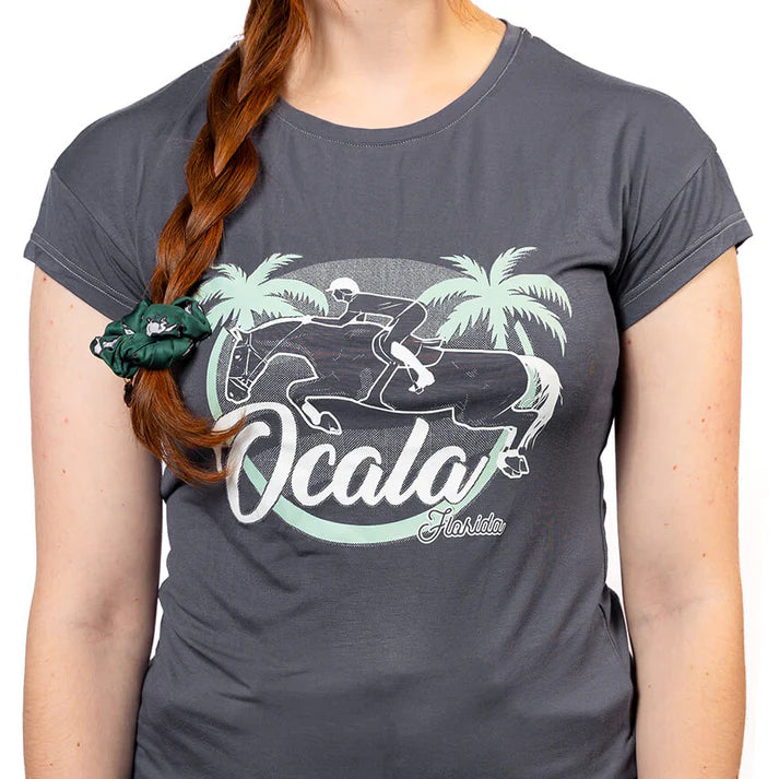 Person wearing a gray t-shirt with 'Ocala' graphic design