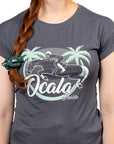 Person wearing a gray t-shirt with 'Ocala' graphic design