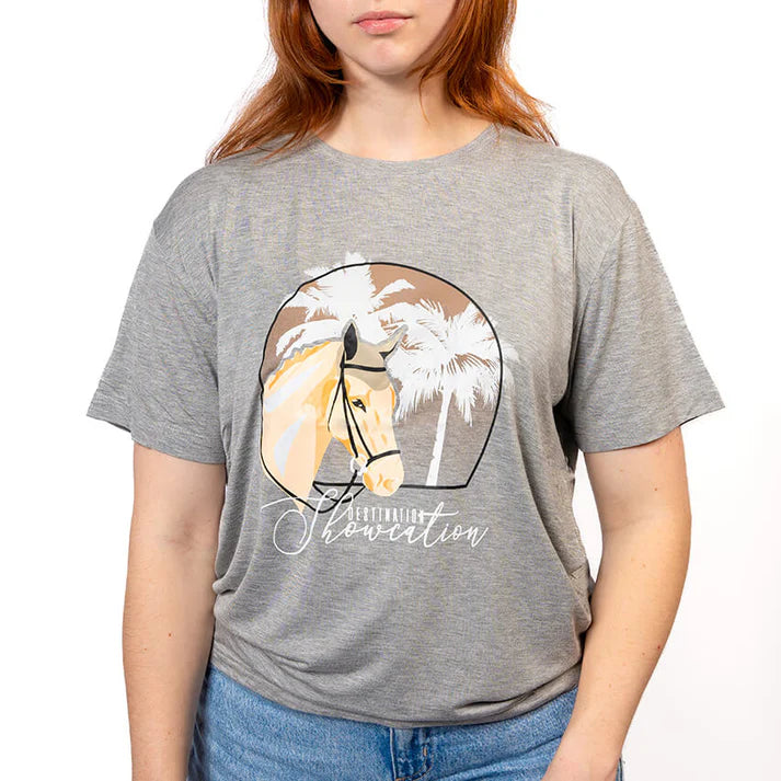 Woman wears grey t-shirt with horse graphic on white background. 
