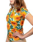 Woman wearing a sunflower patterned shirt on a white background