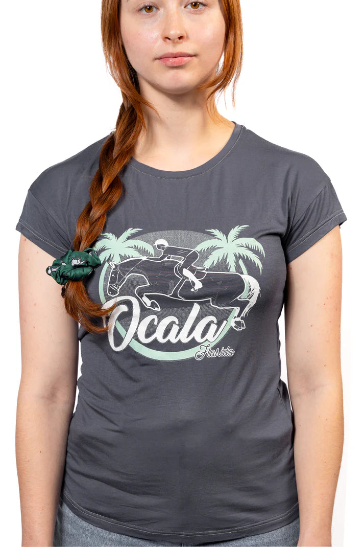 Person wearing a gray t-shirt with 'Ocala' graphic design