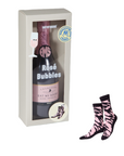 Bottle of Rosé Bubbles with packaging and zebra-patterned socks on a white background