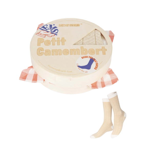 Cheese-shaped package with 'Petit Camembert' text and a pair of socks on a white background