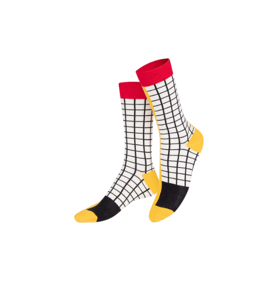 Pair of socks with a grid pattern, red top, black and yellow toes on a white background