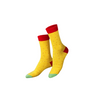 Pair of yellow socks with red tops and green toes on a white background