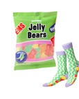 Packing mimics bag of Jelly Bears candy with a pair of green and purple zigzag patterned socks on a white background