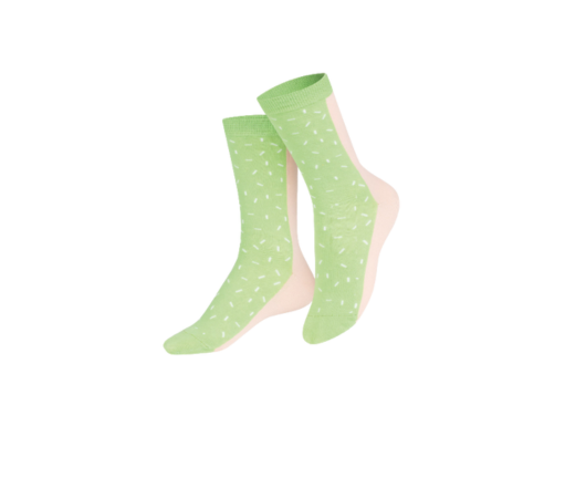 Pair of green polka dot socks on a white background