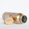 Gold insulated bottle with wooden cap on a white background