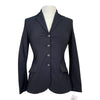 Black blazer on a mannequin with a white background