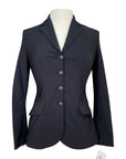 Black blazer on a mannequin with a white background
