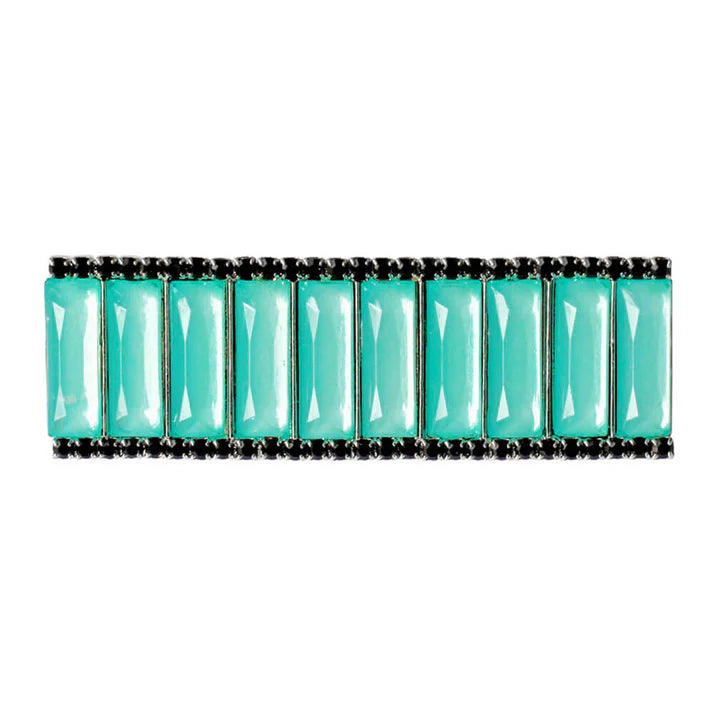 Rectangular stock pin with green and black gems on white background.