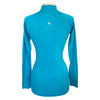 Back of Anique Signature Sun Shirt in Peacock Blue